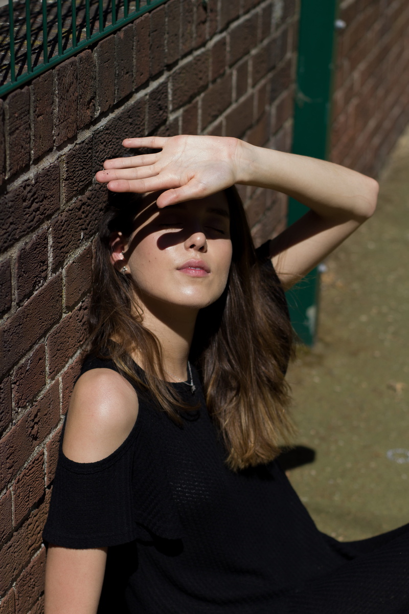 brick, outdoors, hair, editorial, united kingdom, casual clothing, one person, shadows, hand, wall, portrait, 5K, pose, standing, leisure activity, long hair