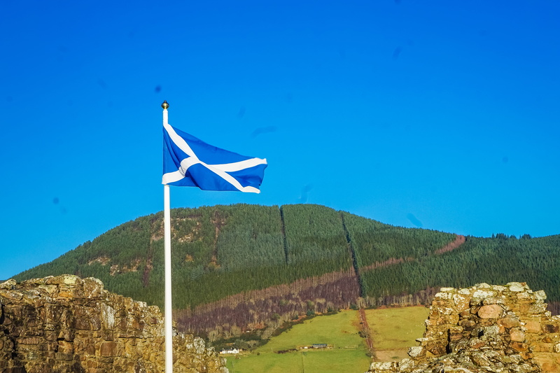 non-urban scene, national icon, united kingdom, mountain, scotland, beauty in nature, outdoors, land, scenics - nature, day, flag, clear sky, landscape