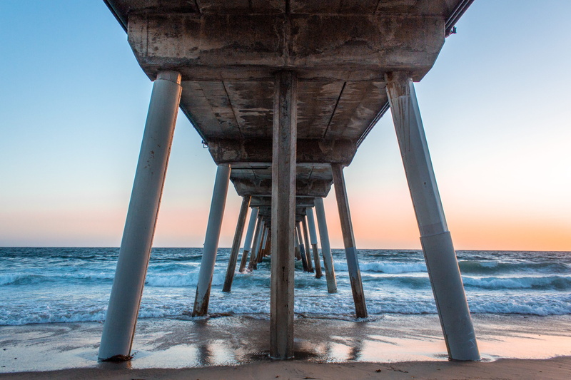 underneath, united states, land, hermosa beach, beauty in nature, sea, sunset, water, architectural column, nature, horizon over water, no people, outdoors