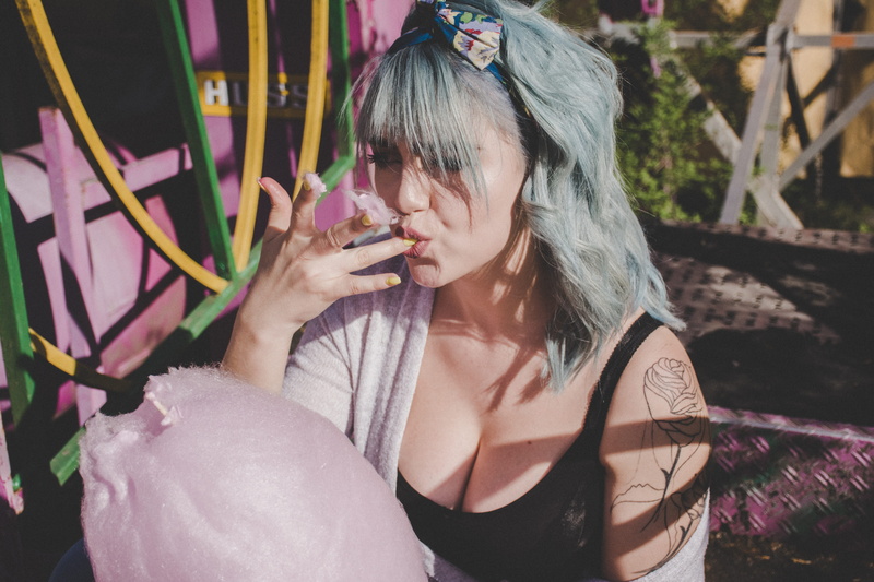 pink, pose, focus on foreground, hairstyle, eating, hair, lick, person, lifestyles, women, adult, one person, eat, portrait, happine, smile, urban, beauty