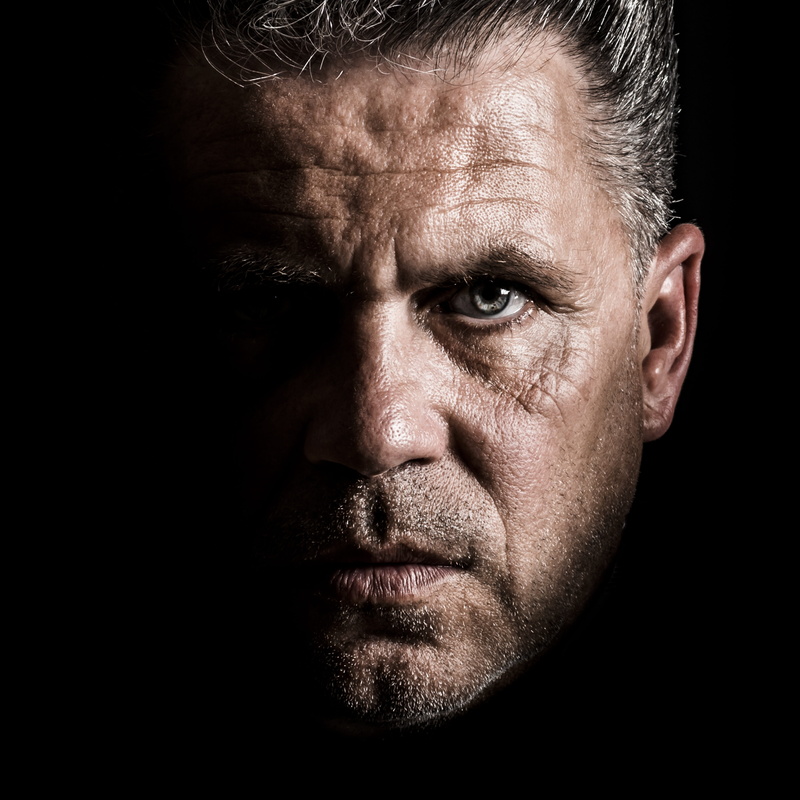 portrait, closeup, face, serious, only men, stress, looking at camera, black background, emotion, negative emotion, look, staff, men, photography, one person
