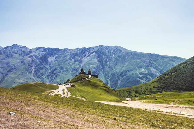 landscape, the caucasus, mountain range, church, outdoors, remote, plant, no people, day, road, environment, clear sky, land, non-urban scene, scenics - nature
