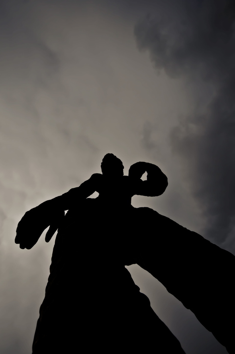 leisure activity, overcast, outdoors, man, hand, finger, sunset, statue, real people, men, cloud - sky, sky, human hand, unrecognizable person, human body part