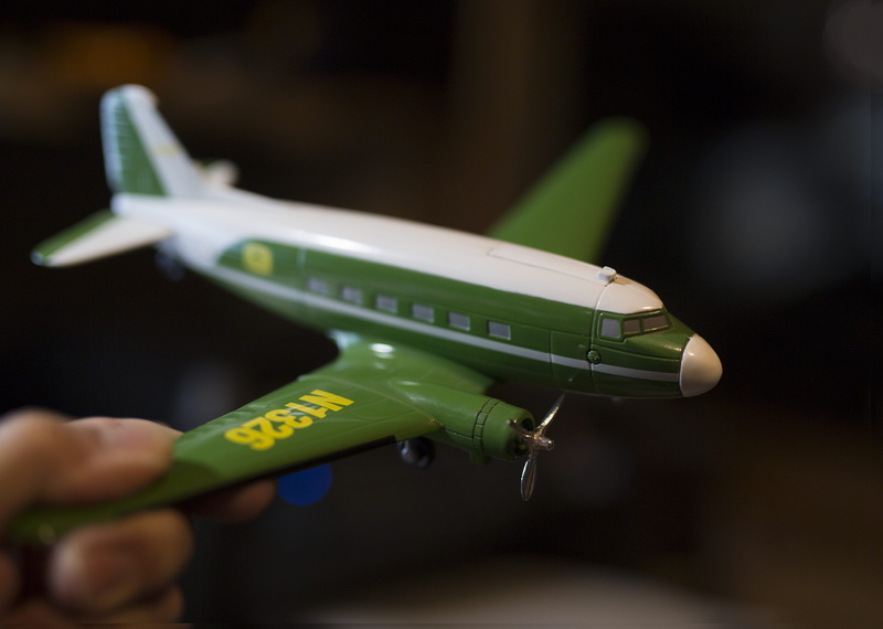 plastic, finger, indoors, aircraft, motor, day, hand, human, focus on foreground, transportation, close-up, spaceship, one person, toy, person, flight