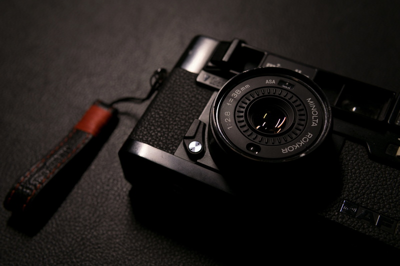 close-up, photographic equipment, technology, camera, single object, equipment, number, table, digital camera, strap, modern, film camera, camera - photographic equipment
