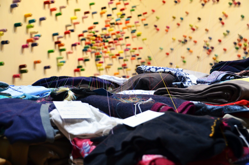 close-up, personal accessory, messy, lying down, multi colored, installation, bag, art, connectedness, bed, damaged, spools of thread, clothing, outdoors
