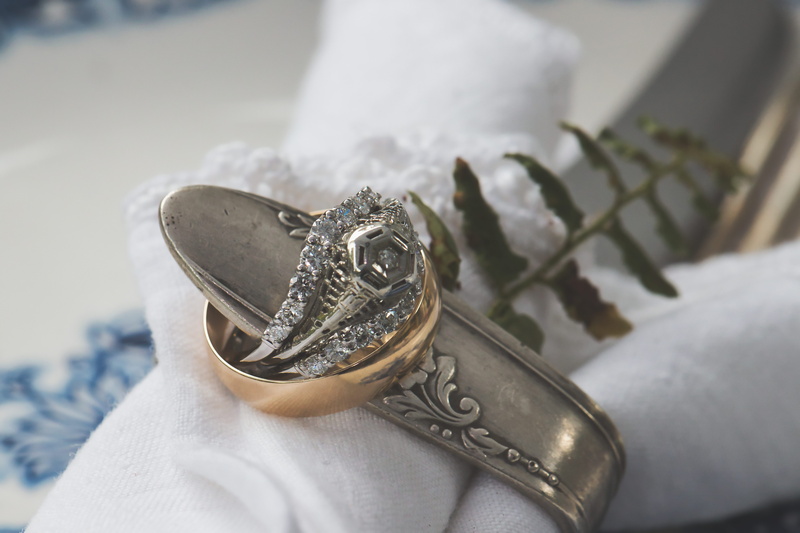 metal, personal perspective, white color, close, ring, adult, 5K, colored, silver colored, rings, pattern, human body part, shining, jewelry, indoors