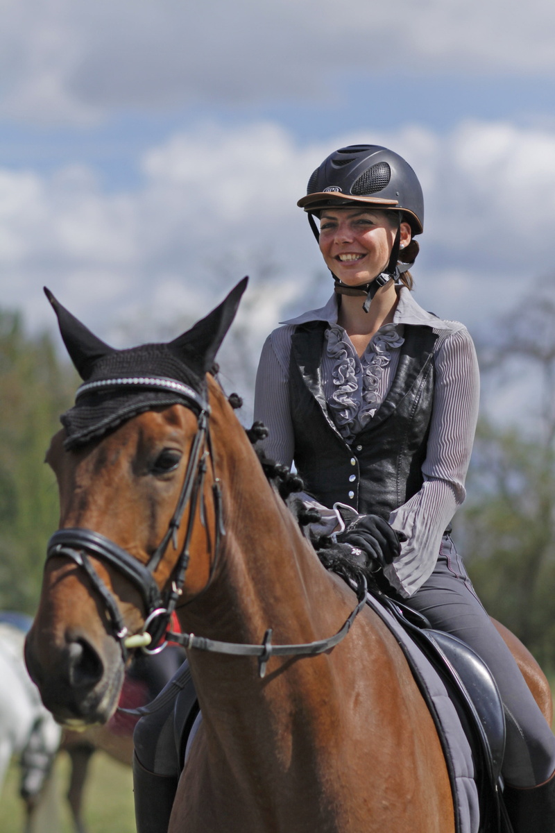 daytime, teenager, domestic, domestic animals, one animal, women, real people, adult, sport, dressage, horsewoman, outdoors, cheerful, front view, horseback Riding