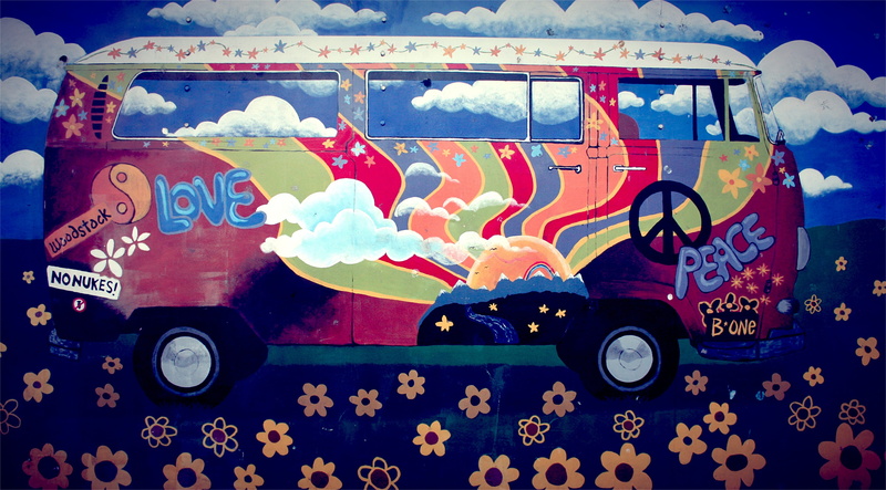 multi colored, mode of transportation, art and craft, motor vehicle, toy, no people, outdoors, text, flower power, animal representation, communication