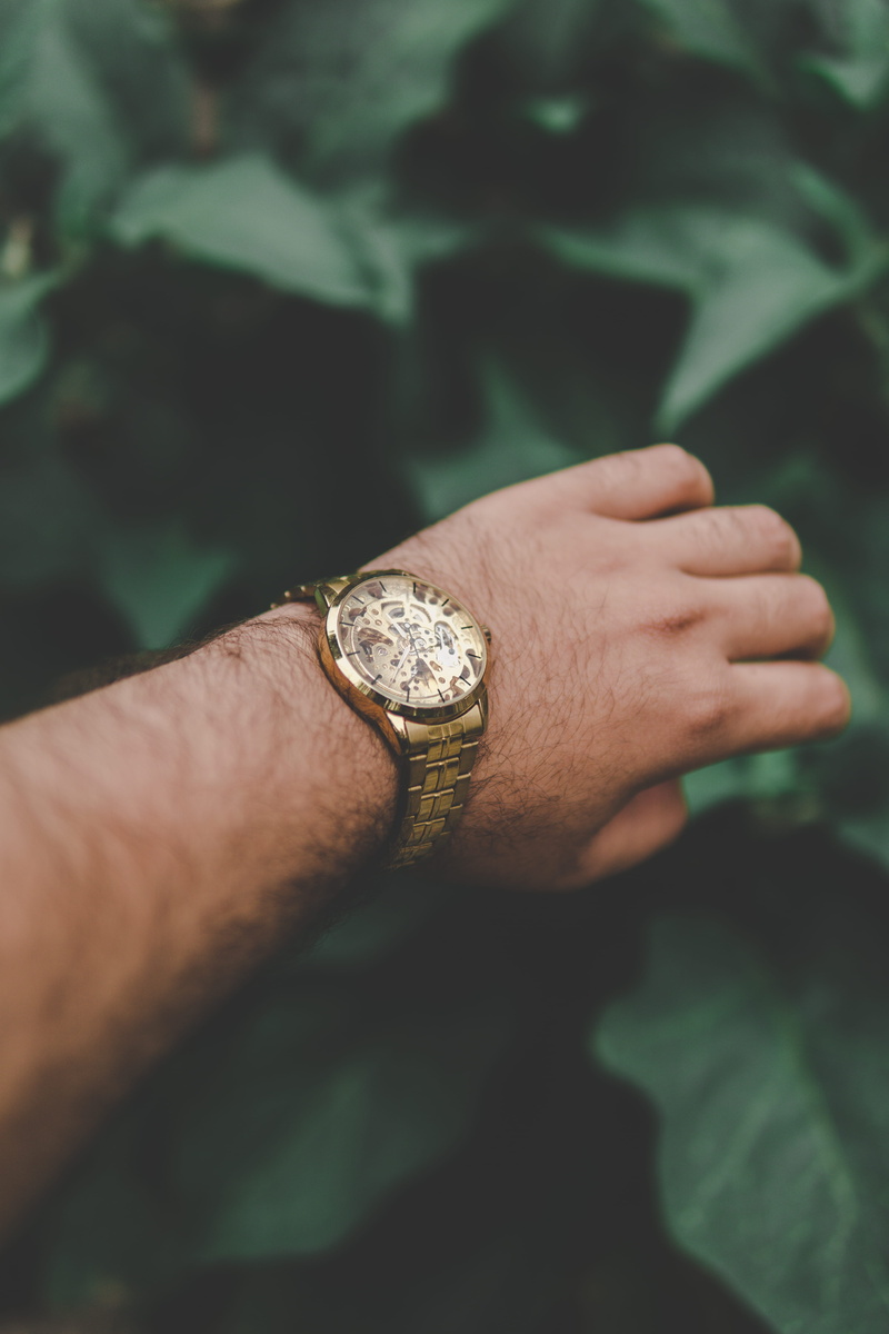 one person, pakistani, human limb, male, person, round, human finger, wristwatch, man, leisure activity, colored, body part, design, hand, outdoors, wearing