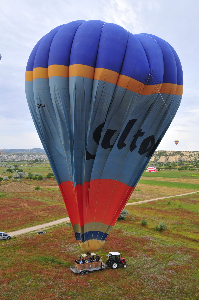 cappadocia, naturale, land, mode of transportation, cloudy, scenics - nature, vivid, rock, spring, air vehicle, ballooning, clouds, adventure, sky, multi colored