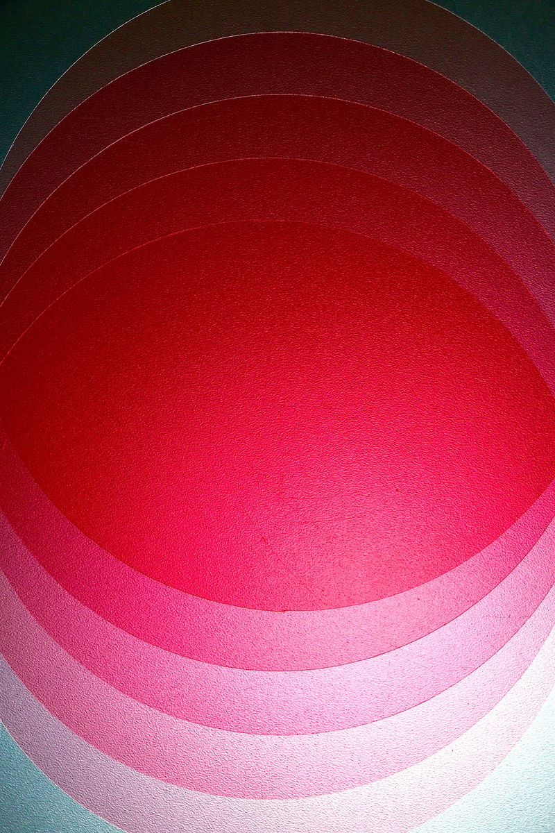 full frame, multi colored, overlapping, low angle view, red, art and craft, geometric shape, still life, indoors, backgrounds, close-up, roundels, shape