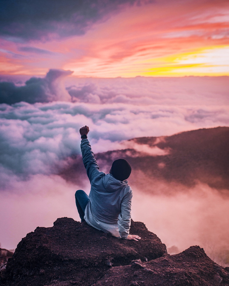 cloud - sky, beauty in nature, sky, one person, outdoors, sunset, golden, celebrate, nature, raising, hand, scenics - nature, casual clothing, left, sitting