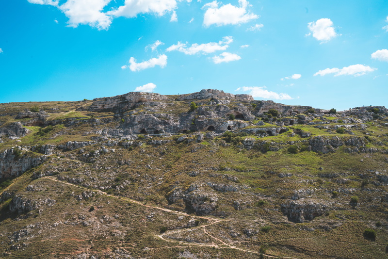 testimonials, tranquility, outdoors, rock - object, sasso caveoso, idyllic, mountain, land, formation, cloud - sky, borgo, day, beauty in nature, sky, tranquil scene