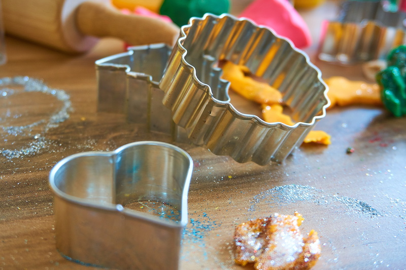 play, leisure, preparing food, glitter, cupcake holder, freshness, human hand, cookies, pastry cutter, wood - material, tinker, children, food, bake, creativity