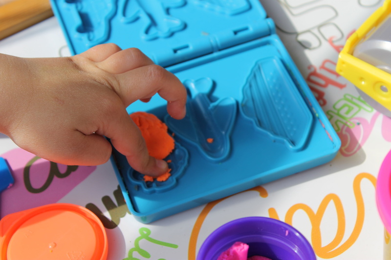 game, human body part, technology, unrecognizable person, education, multi colored, human finger, colorful, high angle view, activity, child kid, communication