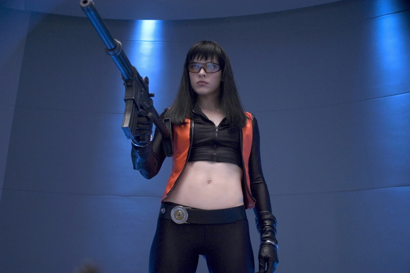 2K, long hair, three quarter length, indoors, looking at camera, leather, young women, portrait, gun, clothing, weapon, young adult, beautiful woman, hairstyle