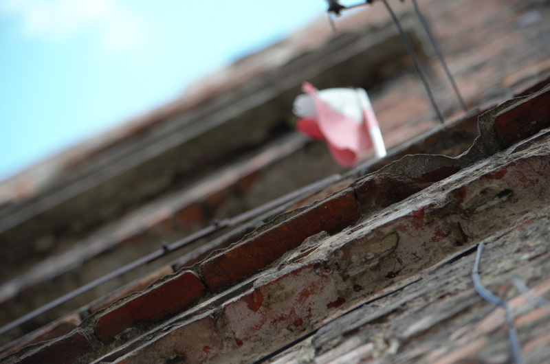 torun, selective focus, damaged, sky, flag, outdoors, no people, built structure, building exterior, metal, rusty, low angle view, focus on foreground