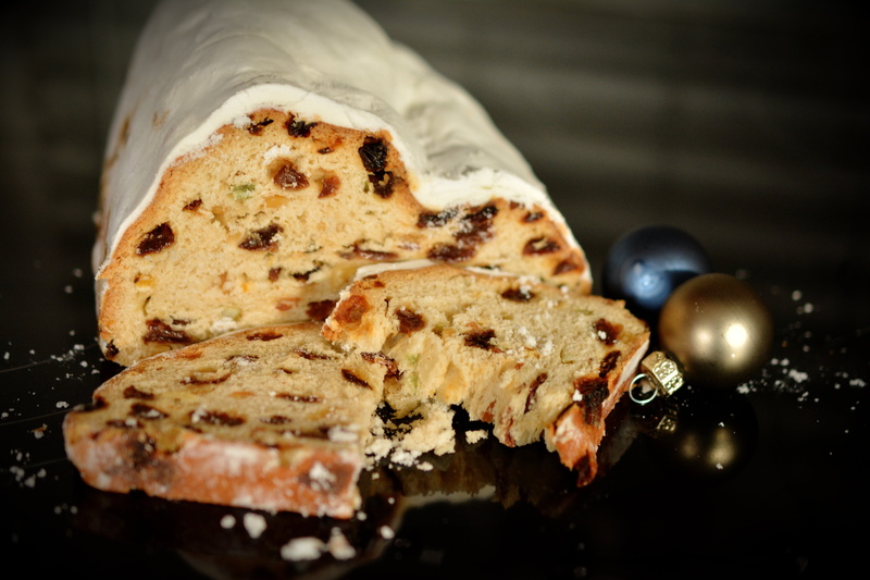 christmas stollen, temptation, ready-to-eat, black background, studio shot, day, close-up, baked, indulgence, focus on foreground, still life, christmas cake