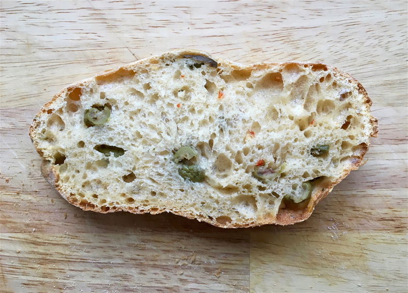 wellbeing, olives, temptation, close-up, slice, directly above, ready-to-eat, bread roll, food and drink, high angle view, roll, wooden board, crumbs, snack