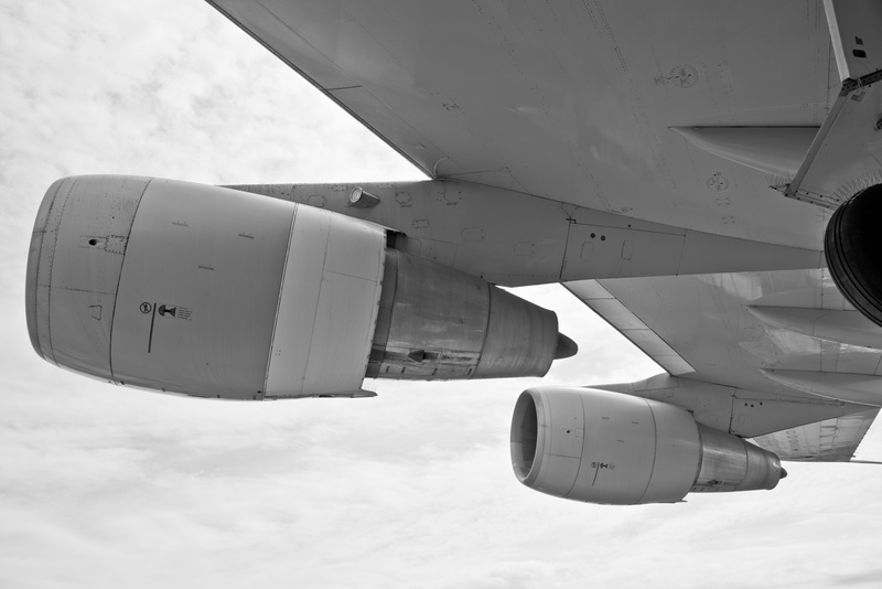 mid-air, aircraft wing, aerospace industry, outdoors, low angle view, cloud - sky, empennage, nature, air vehicle, jet engine, airliner, silhouette, turbine