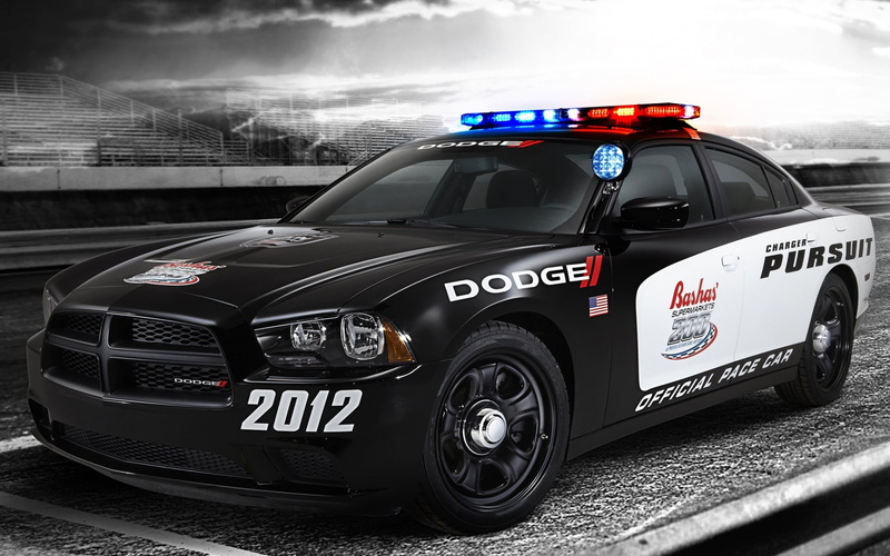 speed, mode of transportation, city, tribune, Pace Car, cloud - sky, motor vehicle, sky, text, Muscle car, motor racing track, number, surveillance, government