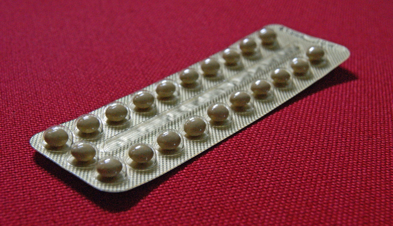 contraception, studio shot, contraceptive pills, pregnancy, red, selective focus, focus on foreground, no people, blister pack, ovulation, contraceptive