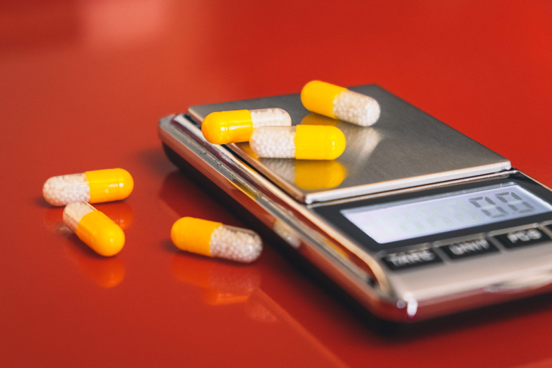 communication, dose, pills, capsule, red background, electronics, indoors, close-up, phone, furniture, 4K, calculator, tablet, oval, pharmacy, illness