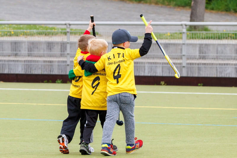 men, children, sports clothing, wearing, field, rear view, togetherness, offspring, sticks, childhood, playing, teamwork, males, yellow, standing, hockey