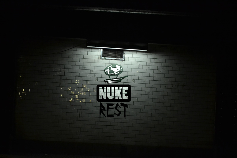 symbol, night, light, lighting equipment, text, built structure, sign, dark, information, glasses, money, indoors, Zeppelin, communication, wall - building feature