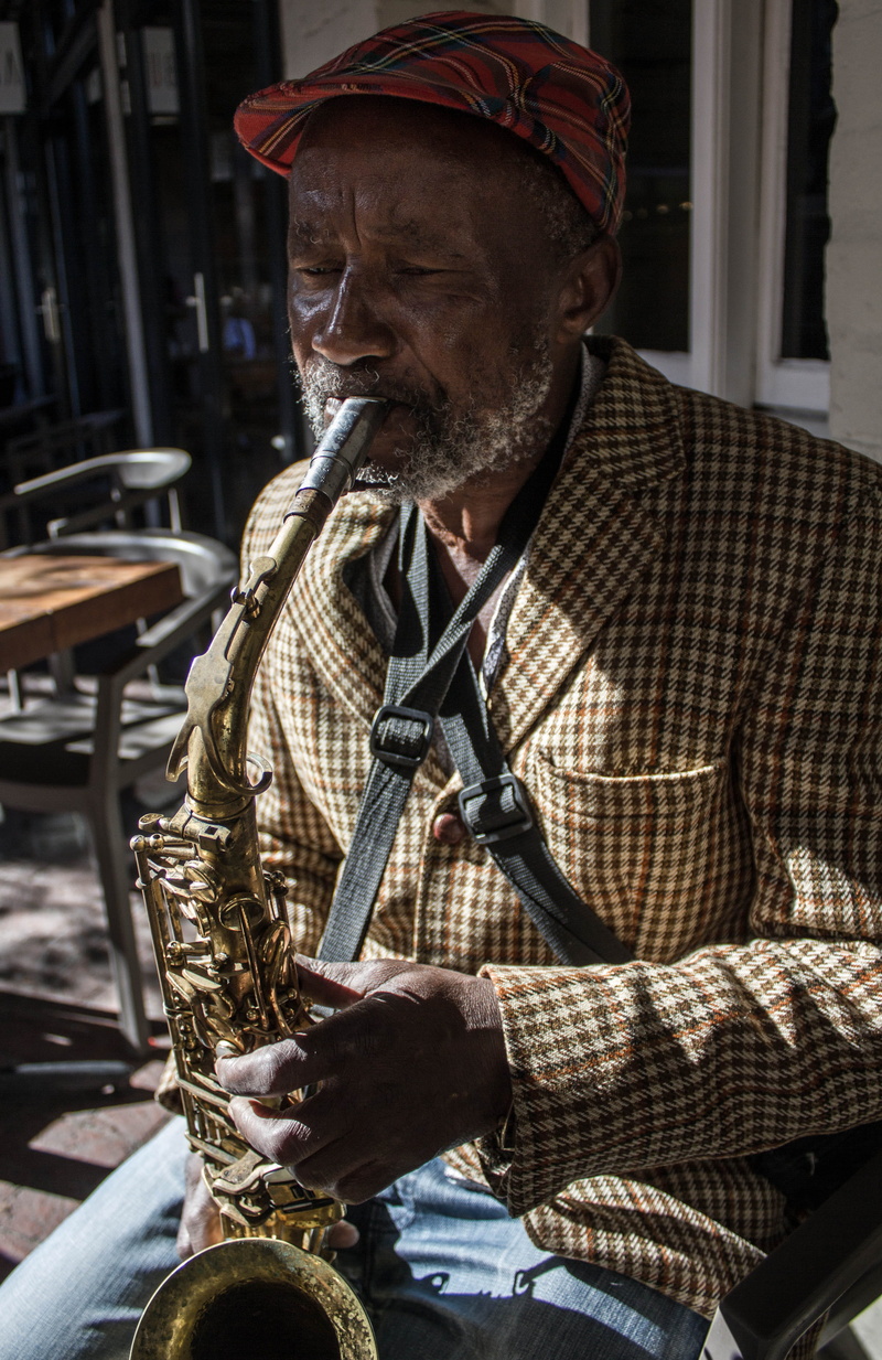 sitting, tweed, musician, portrait, music, lifestyles, adult, saxophonist, arts culture and entertainment, holding, south africa, skill, musical instrument
