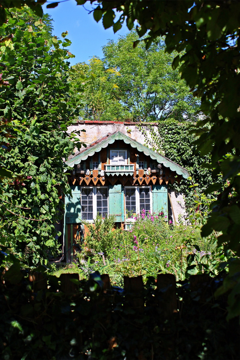 architecture, sun, outdoors, roof, low angle view, house, light, built structure, romantic, 5K, nature, window, log cabin, leaf, plant, old, green color