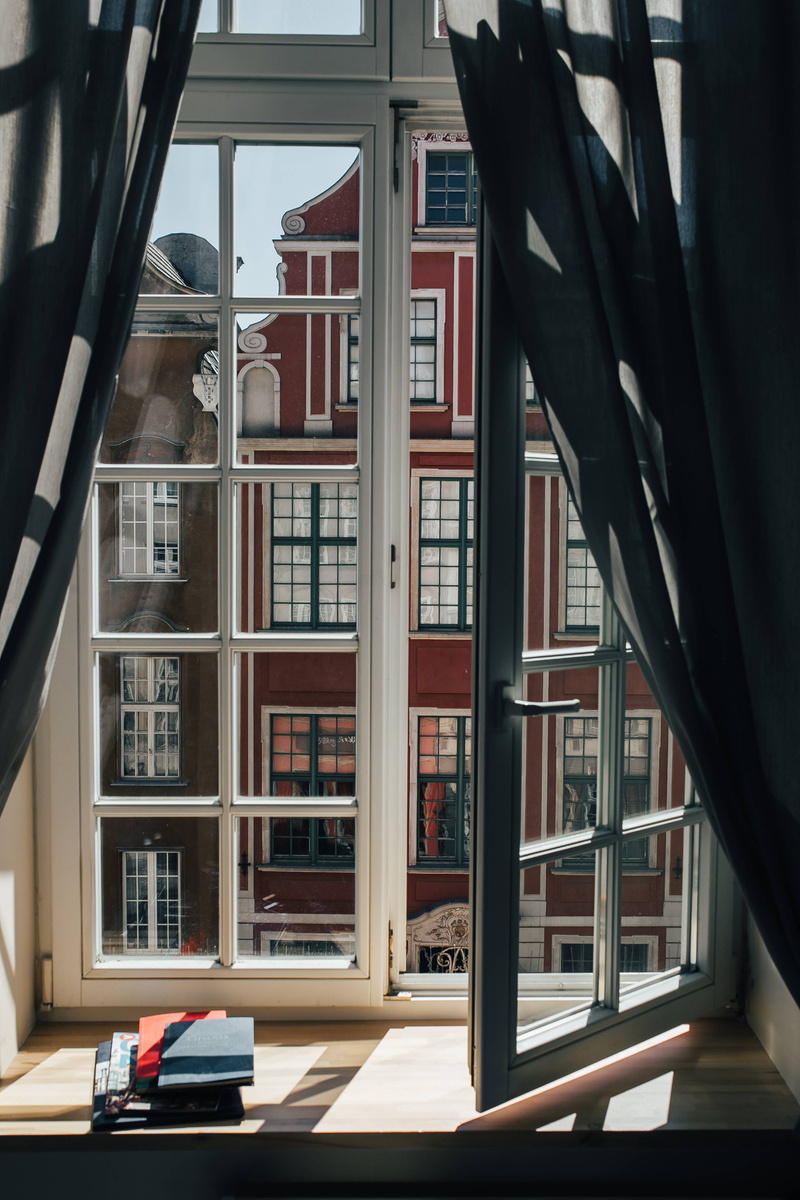 building, glass - material, day, View, buildings, outdoors, tenement house, shelf, building Exterior, built Structure, library, bookshelf, publication