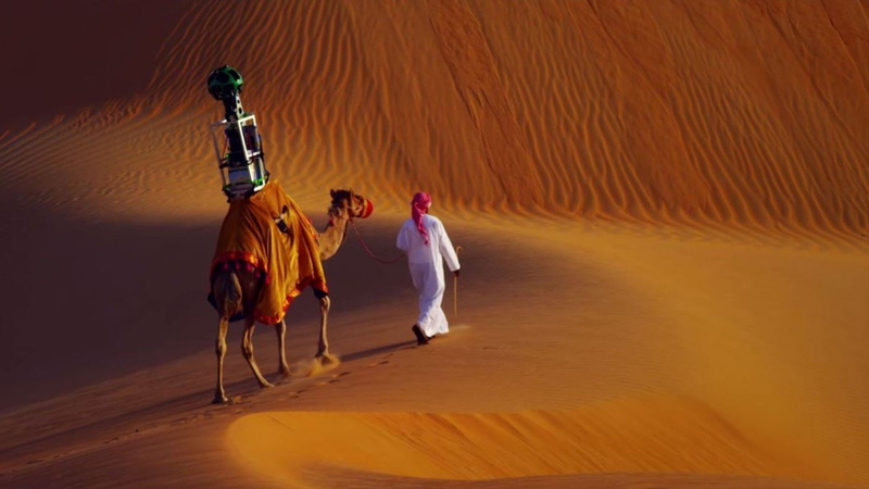 adult, sand, mammal, camels desert google google street view camera liwa desert, camel, 1080P, one animal, group of people, working animal, full length