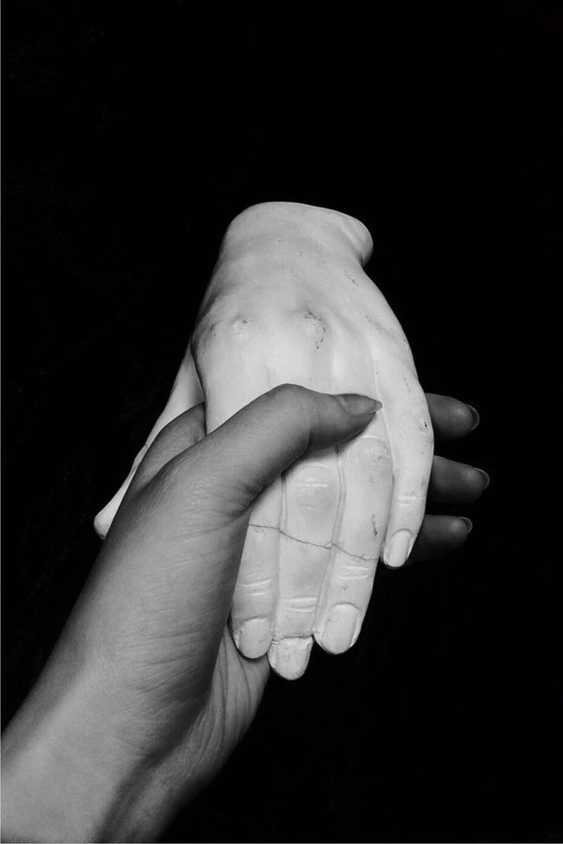 stone, human hand, man, indoors, handshake, personal perspective, care, shadow, human limb, human body part, women, darkness, human finger, one person