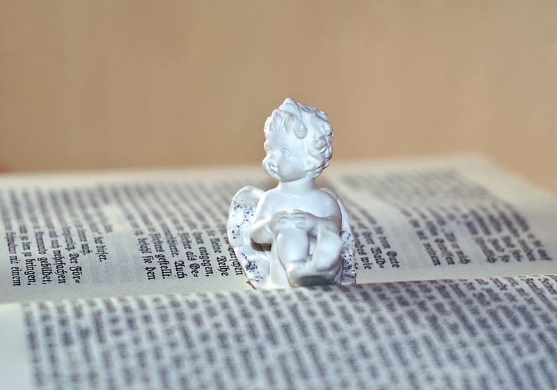no people, book, innocence, decorative, relaxation, joy, german, paper, statue, toy, indoors, ornament, old text, close-up, the passion of the christ, expense