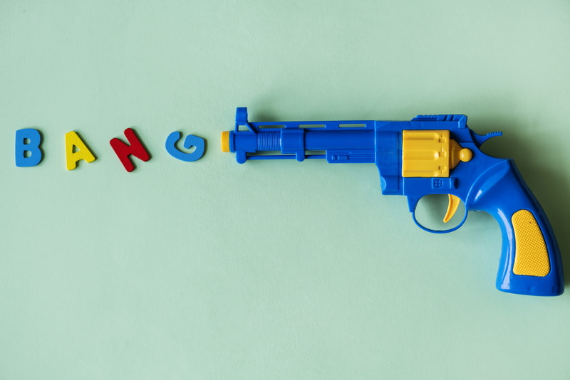 handgun, pistol, loaded, defense, childhood, text, western script, game, children, no people, toy, fun, object, bang, bright, yellow, joy, fake, isolated