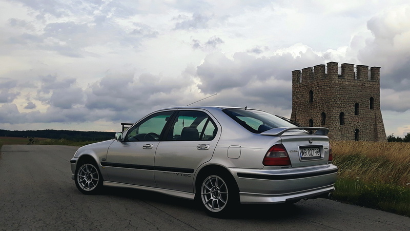 built structure, architecture, nature, motor vehicle, overcast, stationary, tower, mode of transportation, transportation, outdoors, sky, land vehicle