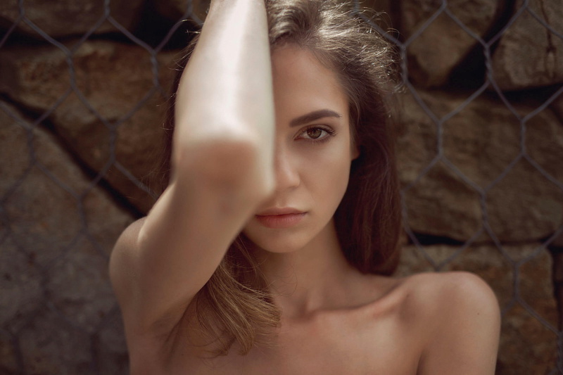 looking at camera, young women, contemplation, women outdoors, front view, armpits, brown eyes, portrait, one person, women, covering face, hair, tanned