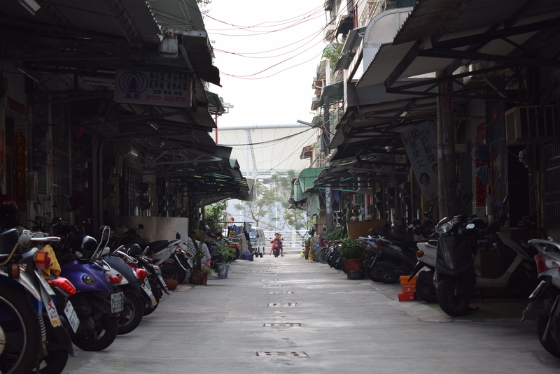 real people, day, crowd, diminishing perspective, direction, taiwan, in a row, building, motorcycle, mode of transportation, building exterior, outdoors