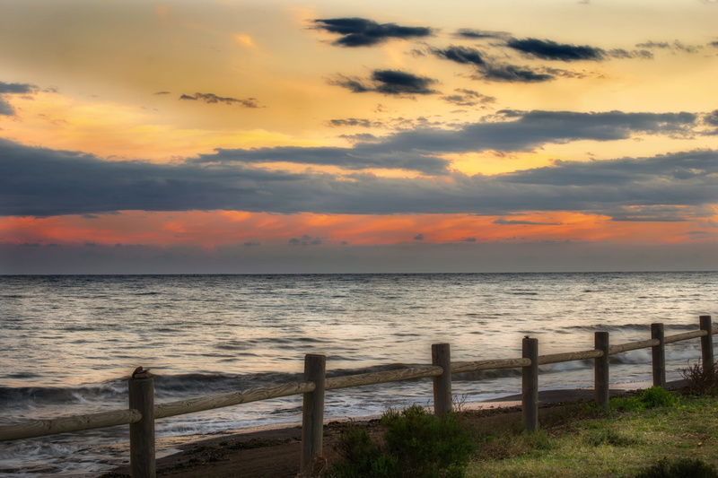 waves, tranquil scene, romantic, landscape, cloud - sky, tranquility, beauty in nature, fence, orange color, sun, sea, no people, sky, horizon over water