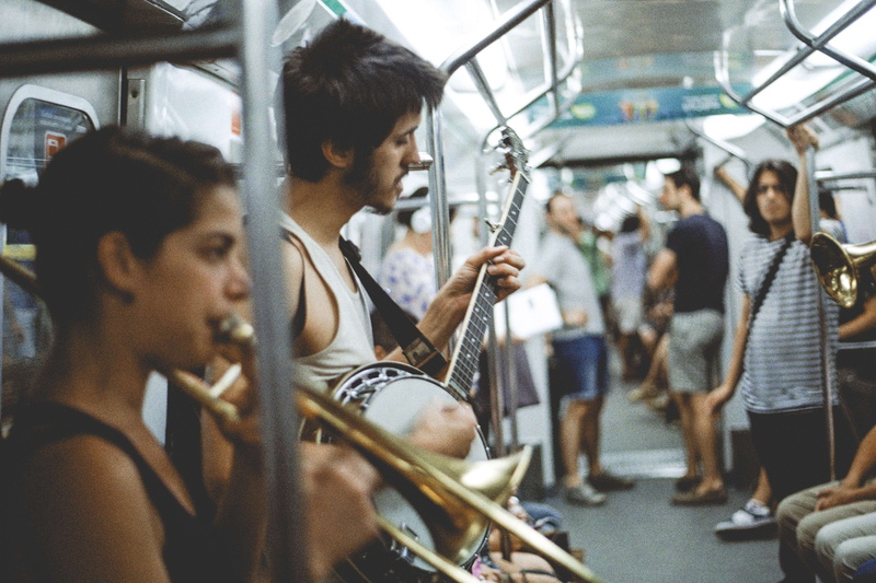 young adult, argentina, sitting, musical instrument, trombone, subway, buenos aires, people, real people, young women, street artist, public transportation