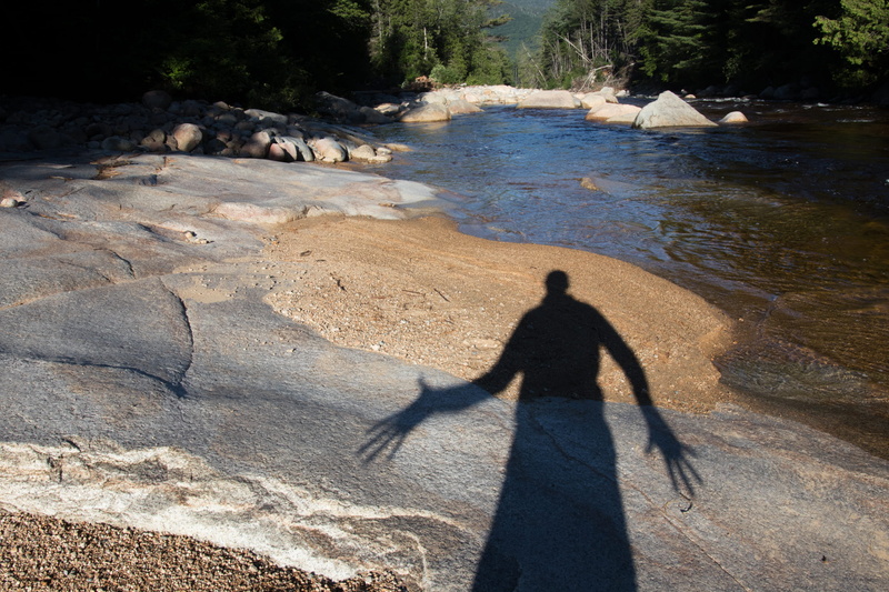 two people, high angle view, water, shadow, land, long shadow - shadow, sunlight, day, lifestyles, outdoors, leisure activity, united states, men, rock