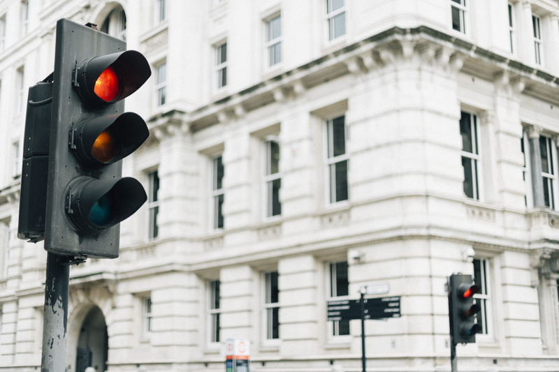 red light, building exterior, no people, warning, road signal, guidance, signal, infrastructure, urban, building, day, communication, light, stop, depth of field