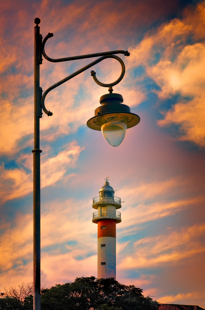 illuminated, black, cloud - sky, unlit, lighthouse, building exterior, street, street light, nature, built structure, clouds, orange color, light, lamppost