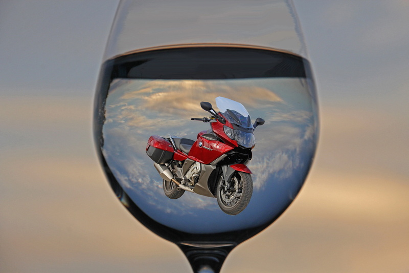 wine glass, day, motorcycle, red, nature, blue, traffic, water glass, attempt, summer, one person, travel, sky, dom, mode of transportation, helmet, transparent