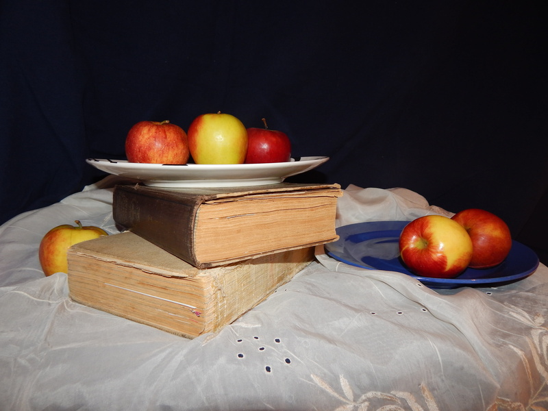 indoors, tomato, healthy eating, no people, black background, publication, vegetable, studio shot, container, still life, book, the attempt, food, cutting board