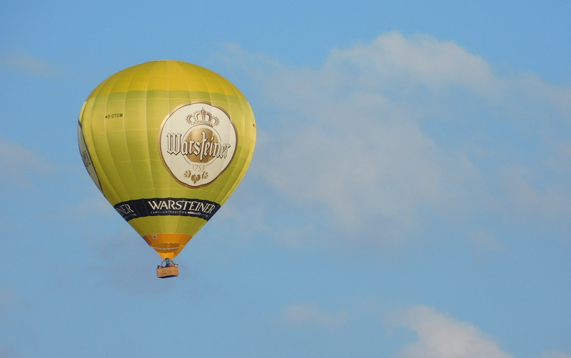 celebration, adventure, blue sky, blue, mid-air, warsteiner advertising, low angle view, Float, outdoors, cloud - sky, yellow, Hot Air Balloon, nature