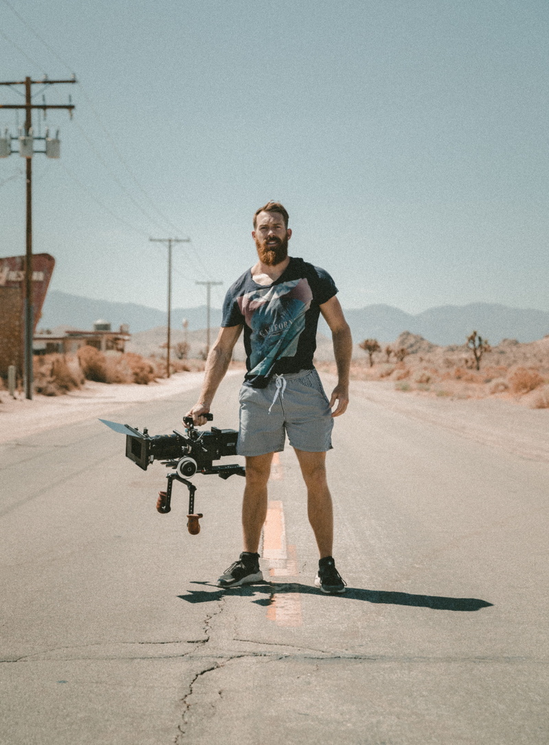 portrait, young adult, lost, sport, camera, carrying, one person, beard, camera len, outdoors, travel, casual clothing, holding, real people, adventure