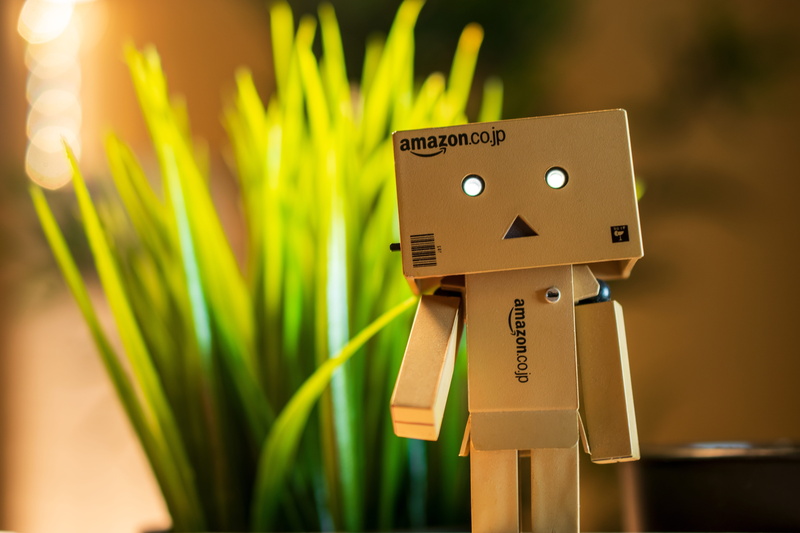number, danboard, focus on foreground, nature, green color, background, toy, outdoors, selective focus, human representation, toys, cardboard, no people